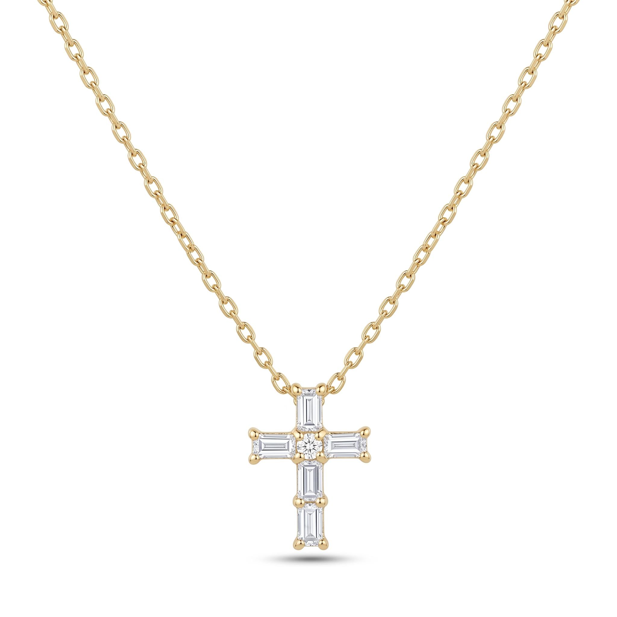 A gold-colored necklace with a cross pendant made of small diamonds.